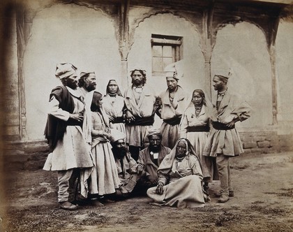 Sikkim and Tibet: eleven people of the Chumba (Chumbi) Valley; two of the women wear large nose rings. Photograph, 18--.