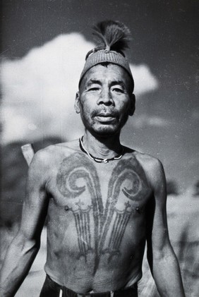 Assam: a Chang Naga man with a head-hunter's tattoo. Photograph by Christoph von Fürer-Haimendorf.