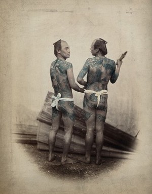 view Japan: two men (bettoes or grooms) with elaborate tattoos. Coloured photograph.