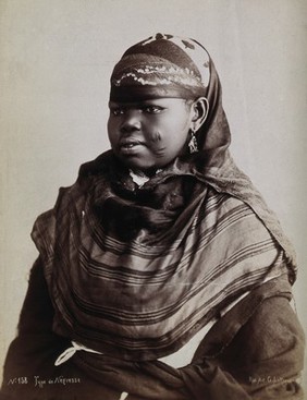 A North African woman with scarification on her cheeks. Photograph by G. Lekegian, ca. 1900.