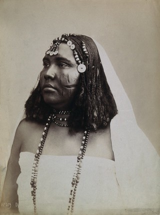 A North African woman with scarification on her cheeks. Photograph attributed to G. Lekegian, ca. 1900.