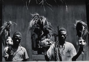 view Benin (Dahomey): men holding staffs made of human skulls with plumes of horsehair. Photograph by Kurt Lubinski (?), 19--.