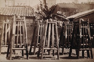 view Canton, China: six men suspended by the neck in locked cages in public as a method of slow torture and execution for piracy. Photograph, 18--.