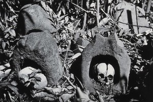 view Assam: a burial place of the Konyak Naga tribe, with heads placed in sandstone hollows above ground. Photograph attributed to Christoph von Fürer-Haimendorf, ca. 1937.