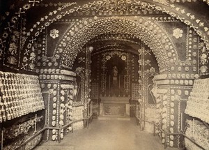 view Skulls and bones of friars, looking towards the altar of a chapel. Photograph.