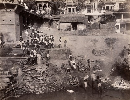 Benares (Varanasi), Uttar Pradesh: corpses being burned and consigned to the river Ganges. Photograph.