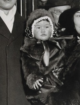 A baby wearing a fur coat and hat, judged "the healthiest baby in London" by Sir James Cantlie in 1921. Photograph, 1921.