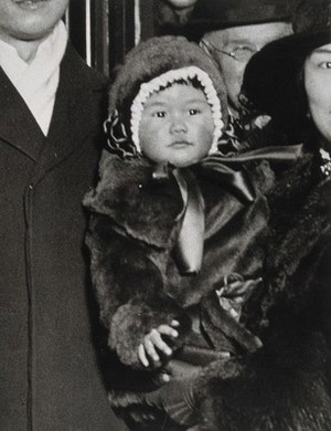 view A baby wearing a fur coat and hat, judged "the healthiest baby in London" by Sir James Cantlie in 1921. Photograph, 1921.