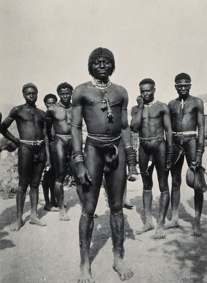 view South Africa: Zulu men wearing penis sheaths and ornamental jewellery. Photograph, ca. 1910 (?).