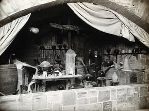 view Wellcome Historical Medical Museum, Wigmore Street, London: reconstruction of a sixteenth-century alchemist's laboratory. Photograph.