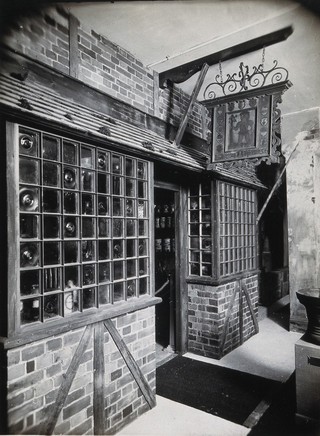 Wellcome Historical Medical Museum, Wigmore Street, London: exterior of a reconstruction of a seventeenth-century English apothecary's shop. Photograph.
