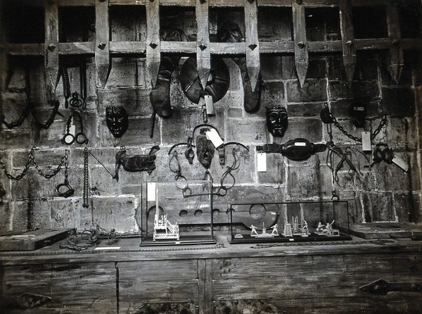 Wellcome Historical Medical Museum, Wigmore Street, London: a display of instruments of torture and appliances for restraint of the insane. Photograph.