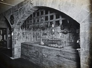 view Wellcome Historical Medical Museum, Wigmore Street, London: a display of instruments of torture and appliances for restraint of the insane. Photograph.