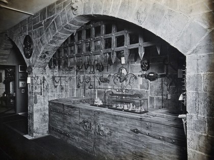 Wellcome Historical Medical Museum, Wigmore Street, London: a display of instruments of torture and appliances for restraint of the insane. Photograph.