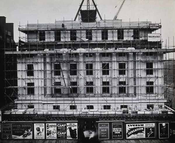 The Wellcome Research Institution's building, Euston Road, London: east side covered in scaffolding during construction by Trollope & Colls, 1931. Photograph.