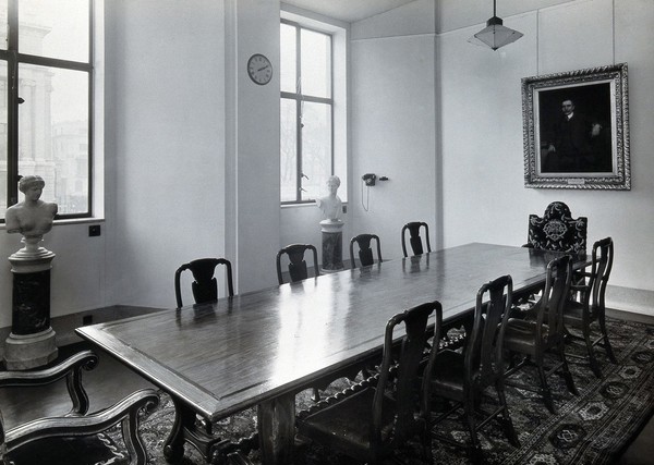 The Wellcome Foundation Ltd., Euston Road, London: a temporary boardroom in the west block of Friends House, with a view of the east side of the Wellcome Building in the background. Photograph, c. 1932.