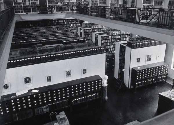 The Wellcome Building, Euston Road, London: the Hall of Statuary as adapted for the Library, c. 1960. Photograph.