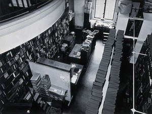 view The Wellcome Building, Euston Road, London: part of the Hall of Statuary as adapted for the Library, c. 1960. Photograph.