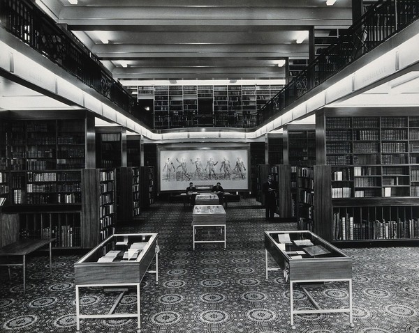 The Wellcome Building, Euston Road, London: the Reading Room after reconstruction of the Library in 1962, facing north, towards the Vesalian Screen. Photograph.