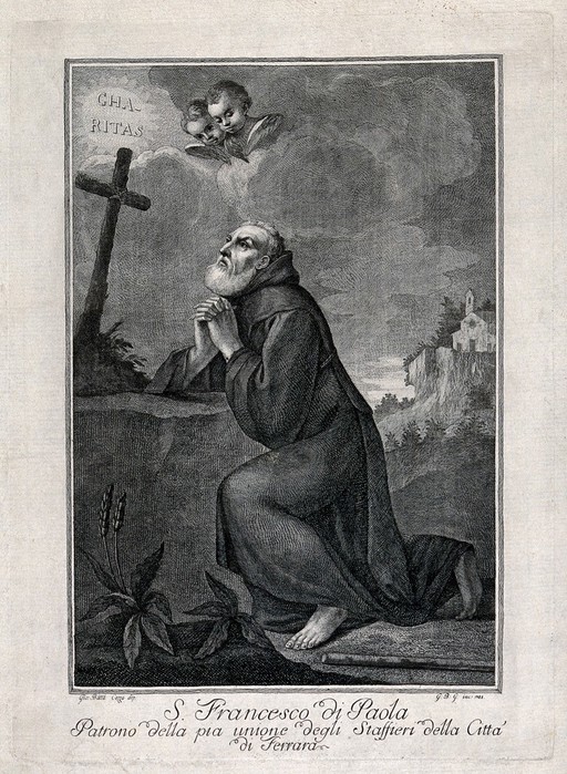 Saint Francis of Paola kneeling in front of a cross