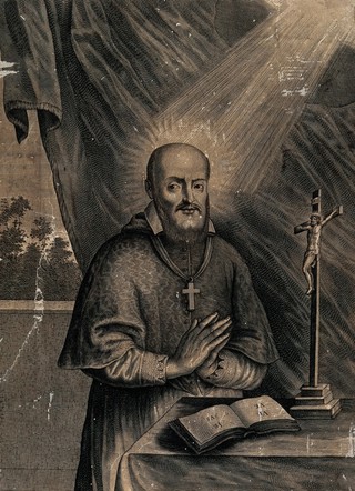 Saint Francis of Sales praying behind an altar. Engraving, 1700/1750.