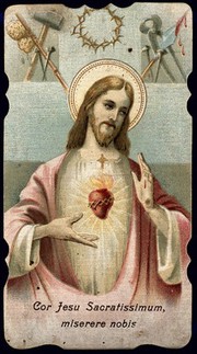 Christ showing the Sacred Heart; above him the Instruments of the Passion. Colour process print, ca. 1915.