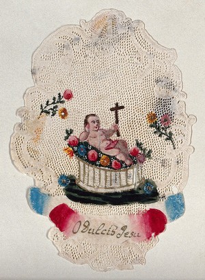 view The Christ Child reclining on flowers holding up the Cross, surrounded by a filigree border. Coloured cut paper work.