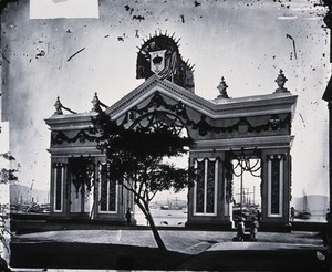 view Triumphal arch, Peddar's Wharf, Hong Kong. Photograph, 1981, from a negative by John Thomson, ca. 1869.