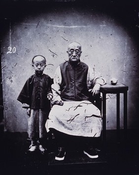 A mandarin and his son, Canton, Kwangtung province, China.
