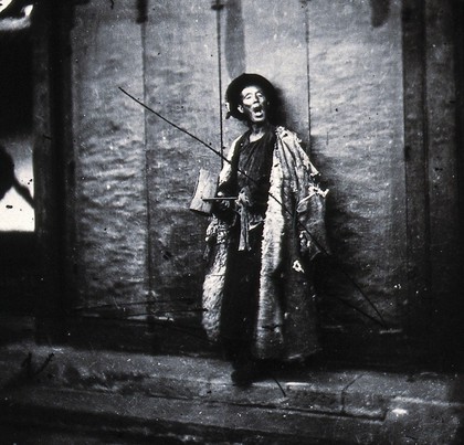 Peking, Pechili Province, China: a nightwatchman. Photograph, 1981, from a negative by John Thomson, 1869.