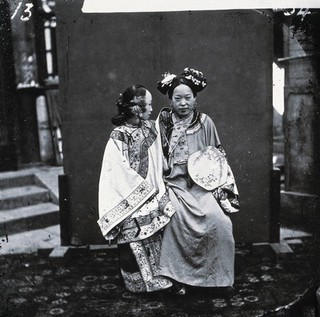 China: a Manchu lady having her face painted, Beijing. Photograph by John Thomson, 1869.