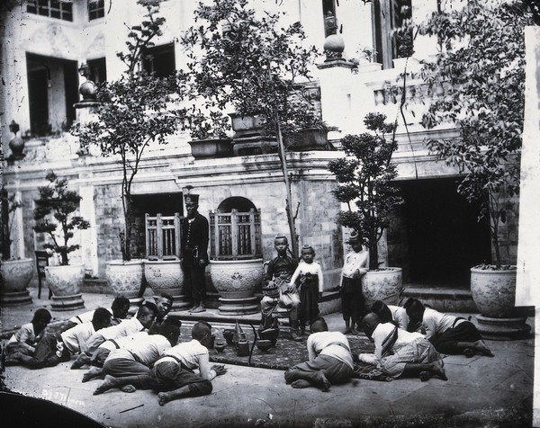 Prince Chulalongkorn of Siam [Thailand] (seated, centre), with Prince Bhanugrangsi Savanwongse (standing next to him) and Prince Kasemsan Sophak (standing, right). Photograph by John Thomson, 1866.