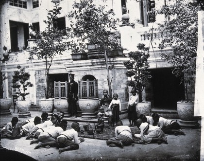 Prince Chulalongkorn of Siam [Thailand] (seated, centre), with Prince Bhanugrangsi Savanwongse (standing next to him) and Prince Kasemsan Sophak (standing, right). Photograph by John Thomson, 1866.