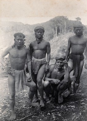 Sarawak: four Punan men. Photograph.