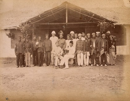 Malaya: two seated Malay dignatories, Tengku Zia Uddin and Raja Ismail, surrounded by their staff and Klang Police. Photograph by J. Birch, 1874.