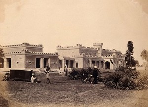 view India: Ludlow Castl, Delhi,e with a sedan-chair and attendants in the garden. Photograph by F. Beato, c. 1858.