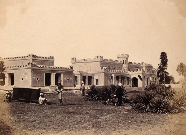 India: Ludlow Castl, Delhi,e with a sedan-chair and attendants in the garden. Photograph by F. Beato, c. 1858.