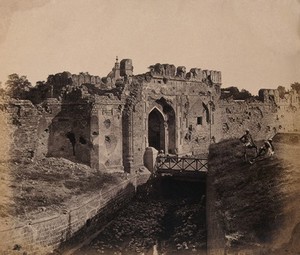 view India: ruins of the 'Cashmere Gate' at a water bastion near Delhi. Photograph by F. Beato, c. 1858.