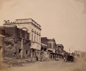 view India: a ruined street showing the house in which the king was confined. Photograph by F. Beato, c. 1858.