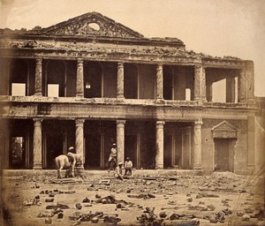 view Lucknow, India: the Secundra Bagh interior showing damage done during the Indian Rebellion; skeletons of murdered Indian rebels lie on the ground. Photograph by Felice Beato, ca. 1858.