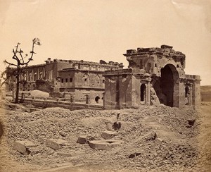 view Lucknow, India: the Lucknow Residency in ruins: gateway and banqueting room, showing damage caused during the Indian Rebellion. Photograph by Felice Beato, ca. 1858.