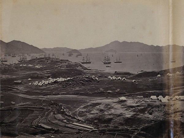 Kowloon, Hong Kong: military encampments on land and fleets in the bay during the Second China War: panoramic view. Photograph by F. Beato, ca. 1860.