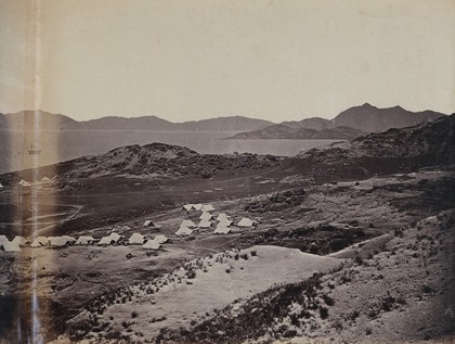 Kowloon, Hong Kong: military encampments on land and fleets in the bay during the Second China War: panoramic view. Photograph by F. Beato, ca. 1860.