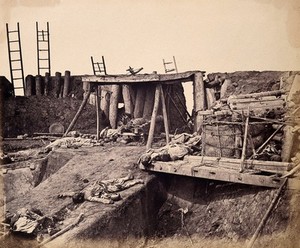 view Taku, China: the North Fort: Chinese corpses following the capture of the fort by the English and French armies on August 21st 1860, during the Second China War. Photograph by Felice Beato, 1860.