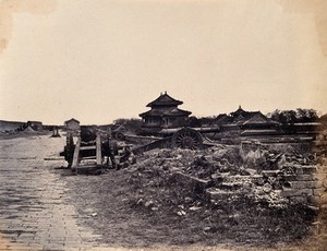 view Beijing, China: Chinese army guns on the city wall, after capture by the English and French armies during the Second China War. Photograph by Felice Beato, 1860.