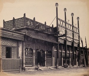 view Beijing, China: an ornate shop exterior in the Tartar quarter. Photograph by Felice Beato, 1860.