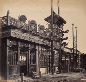 view Beijing, China: an ornate shop exterior in the Chinese quarter. Photograph by Felice Beato, 1860.