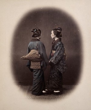 view Two Japanese young women wearing traditional dress. Coloured photograph by Felice Beato, ca. 1870.