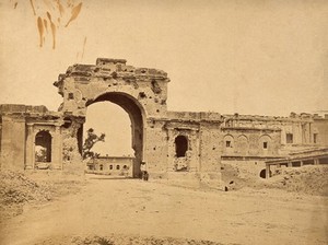 view Lucknow, India: the Lucknow Residency in ruins due to damage caused during the Indian Rebellion: an entrance gate. Photograph by Felice Beato, ca. 1858.