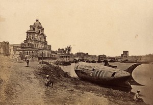 view The Chutter Munzil palace, Lucknow, India; a fish-shaped boat in the foreground. Photograph by Felice Beato, ca. 1858.